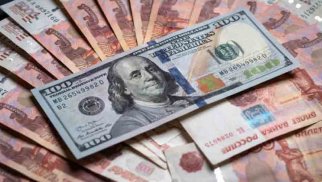 Moskva birjasında dollar 60 rubldan aşağı düşdü